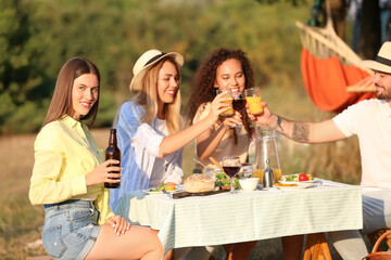 Friends at picnic on summer day