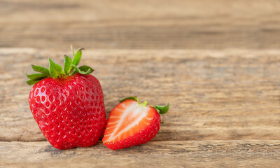 Ripe strawberry on wooden background