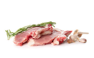 Raw pork steaks with rosemary on white background