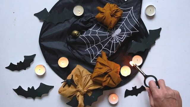 Halloween furoshiki gift Zero waste, Halloween eco-friendly gift wrapping in traditional Japanese Furoshiki style, environmental gift wrapping concept, eco friendly banner flat lay.
