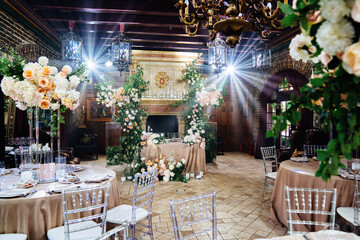decor of fresh flowers in the restaurant for a wedding banquet.