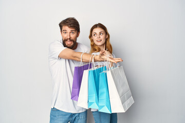 man and woman multicolored shopping bags shopping sale entertainment