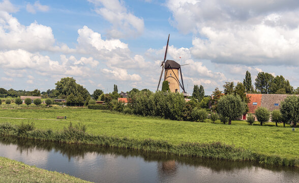 View over the Dutch village of Terheijden from the "Kleine Schans". The scaffolding mill "De Arend", a national monument, was built in 1742 and is still in daily use as a grain mill.