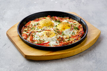 Eggs with bell pepper and tomato baked in oven