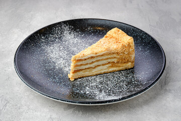 Triangular piece of classic Napoleon cake