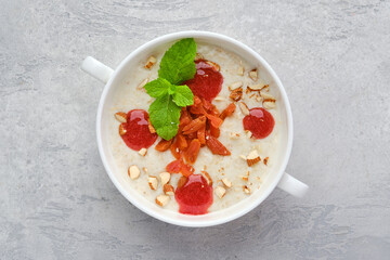Top view of oatmeal with almonds and dried apricots