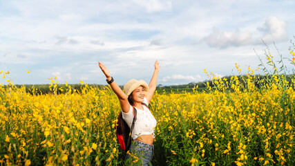 Panorama freedom lifestyle traveler woman arm up joy fun beautiful nature view scenic landscape yellow flower blooming, Outdoor active tourism travel Thailand summer vacation, Blossom floral in Asia