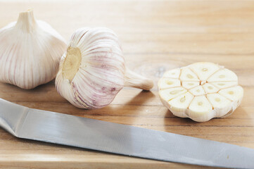 still life photo with garlic - whole garlic and cut in half
