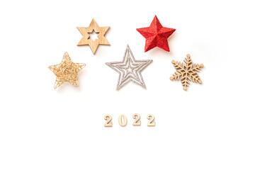 Fototapeta na wymiar Christmas 2022 minimal composition or New Year celebration. Red,silver and golden decorations on white background. Flat lay, top view, copy space. 