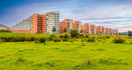Fototapeta na wymiar Maasboulevard big buildings with field, 's-Hertogenbosch, Brabant, Holland