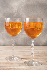 Homemade Aperol spritz. Orange cocktails on wooden table. Simple Aperol Spritz Recipe. Aperol spritz in a glass with ice