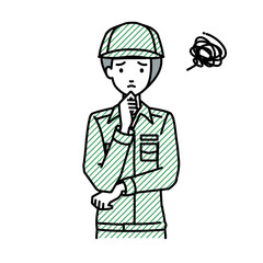 立って手をあごにあてて困っている作業員の女性