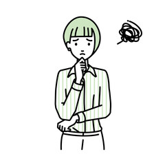 立って手をあごにあてて困っているブラウスの女性