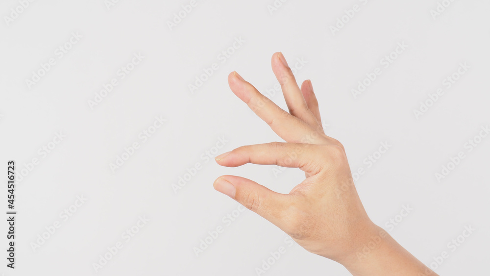 Wall mural empty hand and finger holding gesture on white background.