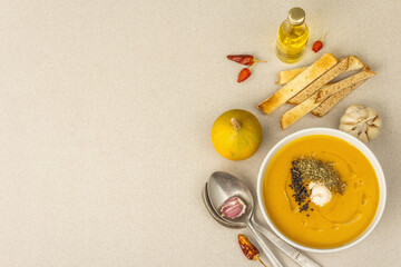 Pumpkin cream soup. Traditional autumn food. Hot dish, ripe vegetables, fragrant spices