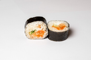 Traditional japanese nigiri sushi, separated on white background, side view