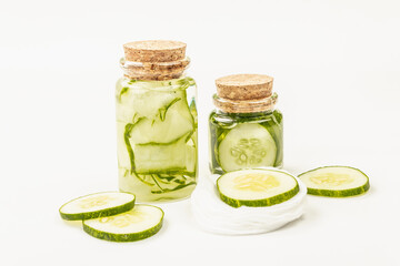 Homemade cucumber cosmetics isolated on white background