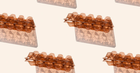 Pattern from empty plastic egg container isolated on gray background. Recyclable material. Waste sorting. Pattern, banner. Recycle Week