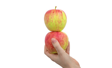 Female hand with two red apples, one on one tower, isolated on a white background photo