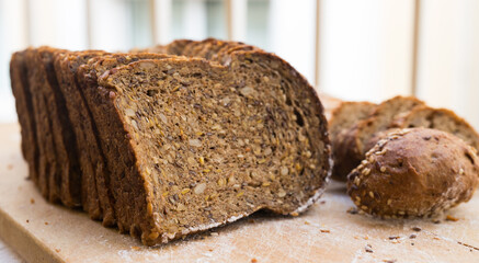 fresh loaf of bread on wooden board