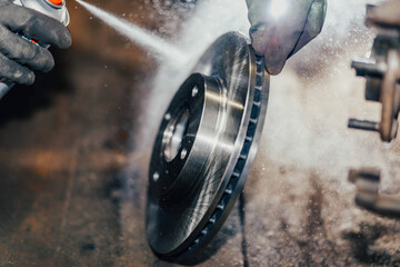 spray for cleaning brake discs. - obrazy, fototapety, plakaty