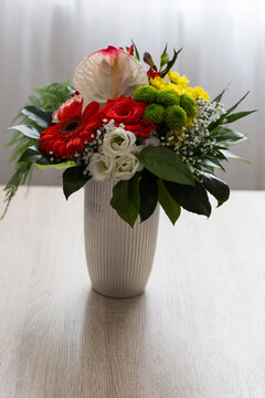 Bouquet Of Roses And Chrysanthemums In A Vase On The Table