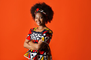 portrait of cute african female with afro hairstyle in traditional dress 