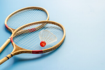 Competitive sports concept. Two badminton rackets and shuttlecock close up