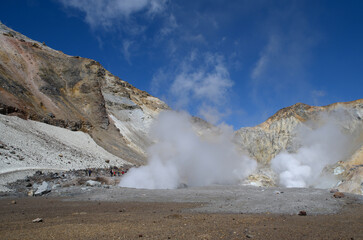 Landscape. The valley of fumaroles in the eruption of boiling water vapor and sulfur.