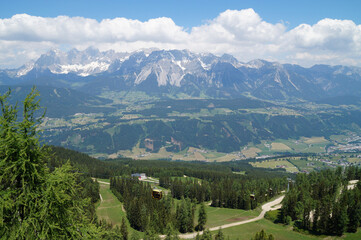 Fototapeta na wymiar a hiking trail overlooking beautiful alpine valley surrounded by the Austrian Alps of the Schladming-Dachstein region (Austria) 