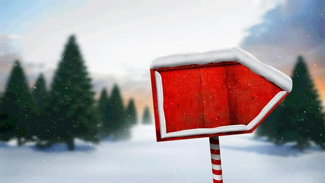 Animation of snow falling and north pole sign with copy space over winter scenery