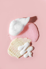 Composition of various cosmetic mask, creams, serum, scrub and lotion smear on a pink background. Beauty texture. Sample of a cosmetic product. - obrazy, fototapety, plakaty