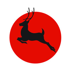 Deer silhouette on the background of the red sun