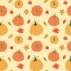 Vector autumn pumpkins with leaves seamless pattern on yellow background.