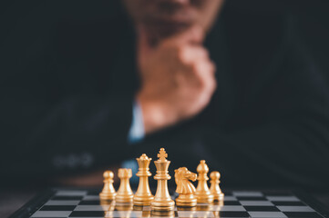 Businessman moves chess with hand.Strategic planning concept about mistakes topple the opposing...