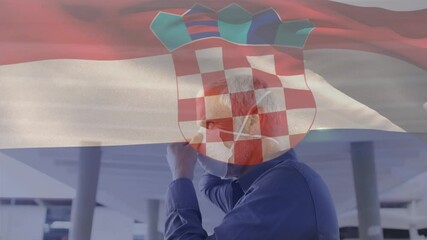 Animation of flag of croatia waving over man wearing face mask during covid 19 pandemic - Powered by Adobe