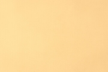 Light yellow cream color surface background wall texture for text and design