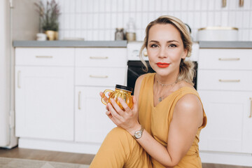 Beauty blondie woman smile in cozy kitchen
