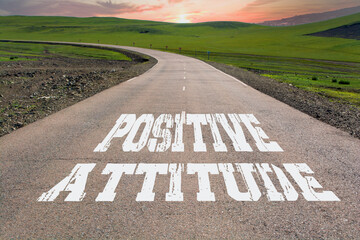 Positive Attitude written on rural road