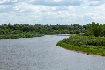 Fototapeta na wymiar View on Winding river in rural area.