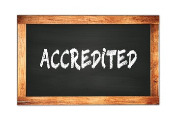 ACCREDITED text written on wooden frame school blackboard.