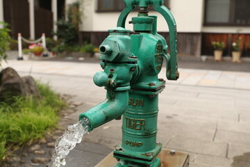 Japanese old pump drains water from well