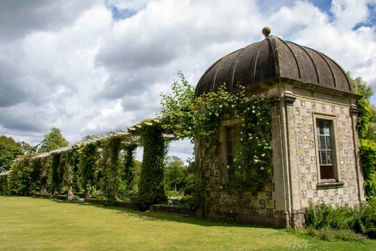 impressive 100 metre long edwardian pergola designed by Harold Peto at West Dean Gardens in sussex