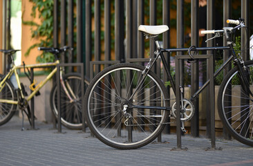 bicycle is parked at outdoor floor rack parking slot