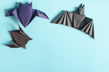 Paper bat toys for the Halloween holiday. Paper origami toys for All Saints ' Day