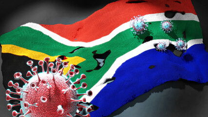 Covid in South Africa - coronavirus attacking a national flag of South Africa as a symbol of a fight and struggle with the virus pandemic in this country, 3d illustration