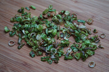 spring onion ingredient roasted rings on wood cutting board