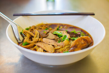 Top view Duck noodle on a white bowl,One of the menu of Thai street street noodles