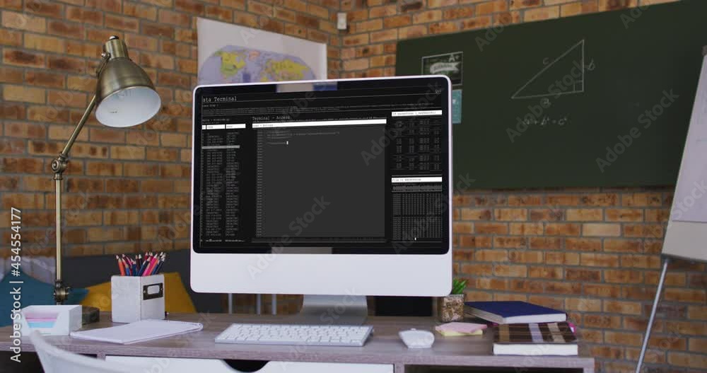 Poster computer screen with data processing standing on desk in office