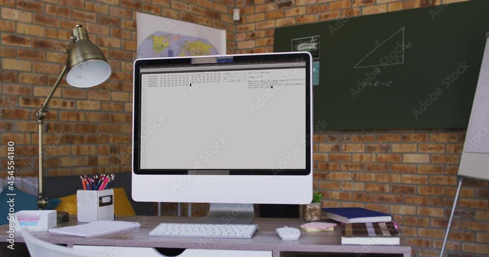 Poster computer screen with data processing standing on desk in office
